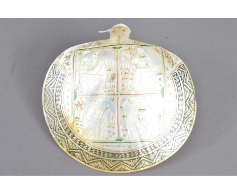 An antique carved mother-of-pearl devotional plaque or baptismal spoon, Jerusalem or Holy Land, 19th Century. Natural shell c