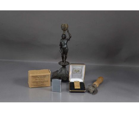 A mixed lot of collectables, including a bronzed figural candlestick, tin opener, two lighters and a "Sestrel" car compass (5