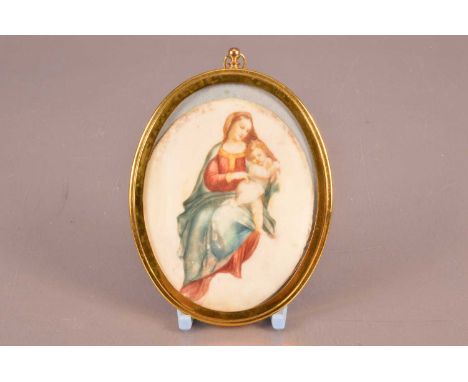 A late Georgian ivory portrait miniature, oval, 9cm by 7cm, in larger gilt metal frame, depicting a Madonna and child, sold w