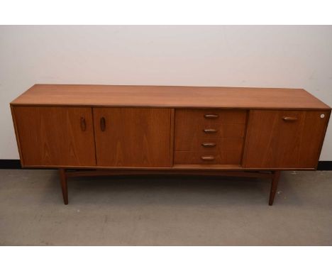 A c1960s G-Plan style teak sideboard, 206cm wide, with drinks cabinet, four drawers and two cabinet doors