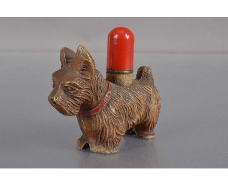 A 20th century base metal Scotty dog novelty table lighter,  with pull off red cap, 7 cm by 6 cm high