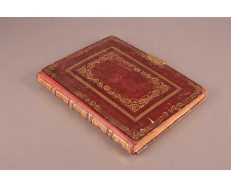 A nice Victorian artist's scrapbook album, red and gilt leatherette book, 28cm high, with poem to inside page and next page w