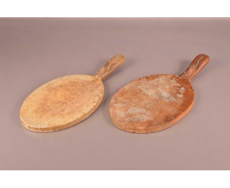 Two carved oak chopping boards in the style Robert "Mouseman" Thompson, 37cm wide, AF (2)