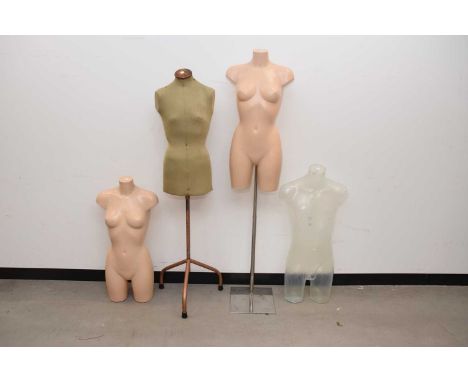 A vintage shop display mannequin together with three further modern examples
