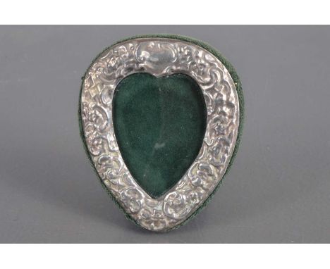 A late 20th century silver heart shaped photograph frame, with embossed decoration, Birmingham 1998, 8.2 cm by 6.8 cm