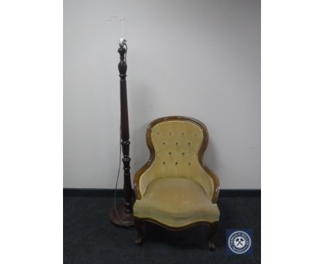 A lady's chair in gold button dralon and a mahogany standard lamp 