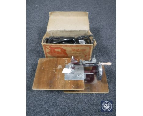 A child's sewing machine together with boxed vintage Hotpoint electric iron
