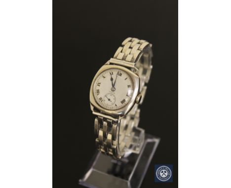 A silver Zenith wristwatch on silver bracelet