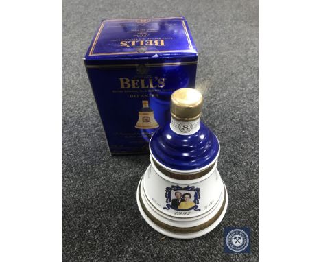 A boxed Bells 70cl Scotch Whisky decanter - Queen Elizabeth II Golden Wedding Anniversary 