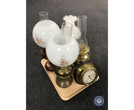 A tray containing a brass oil lamp with glass chimney and shade together with a converted brass oil lamp and two table lamps 