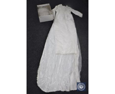 A box of vintage wedding dress and vale 