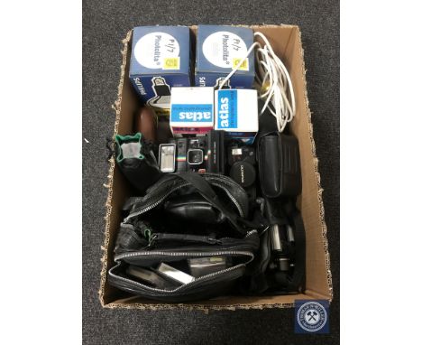 A box of a large quantity of assorted camera equipment including Olympus cameras, lenses, photographic lamp bulbs etc CONDITI