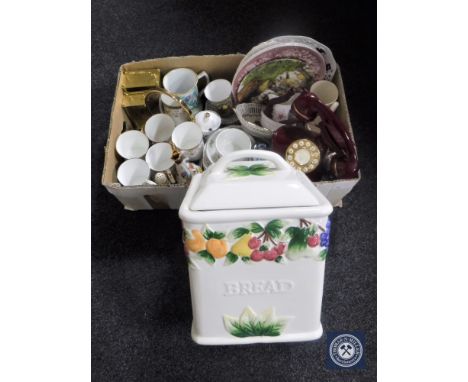A box of wall plates, tea china, mantel clock, retro style telephone and lidded bread bin 