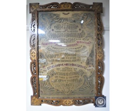 An Edwardian carved oak framed fretwork panel depicting The Lords Prayer 