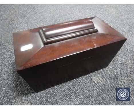 A mahogany sarcophagus form tea caddy 
