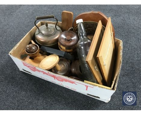 A box containing vintage glass bottle, wooden wall plaques, antique copper kettle, biscuit barrel etc