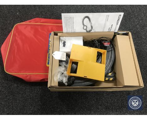 A micro Scalextric set in carry bag
