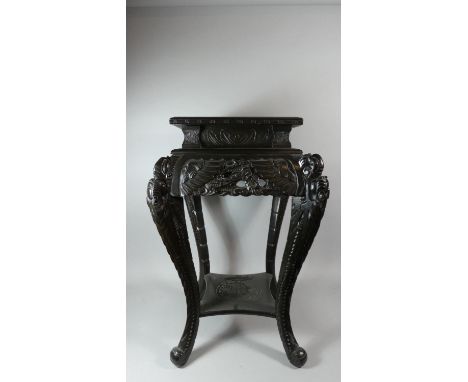 A Large Ebonised Vase Stand with Carved Panels and Cabriole Legs in the Form of a Dragons, Stepped Top with Crossbanded Inlay