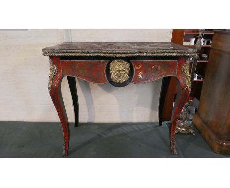 A 19th Century Ormolu Mounted French Inlaid Boulle Work Lift and Twist Games Table with Mask Mounts, Serpentine Hinged Top wi