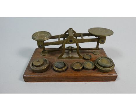 A 19th Century Set of Brass Postage Scales and Weights on Wooden Plinths, 16cm Wide 