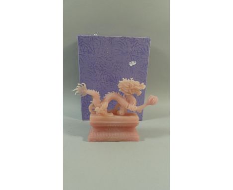A Boxed Oriental Resin Study of a Dragon with Pearl, 20cm high 