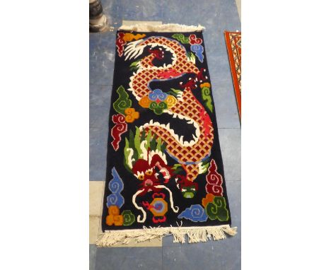 An Oriental Patterned Woollen Rug Depicting Dragon Chasing Flaming Pearl, 130cm x 63cm 