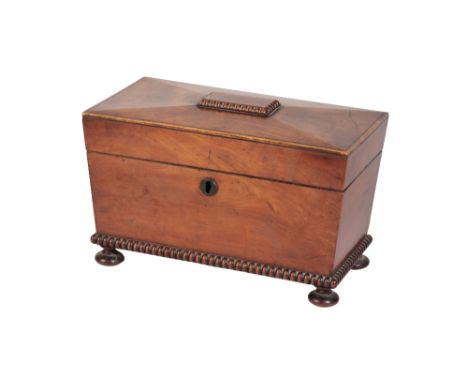 REGENCY MAHOGANY TEA CADDY of tapering rectangular form, the interior with twin lidded compartments divided by a glass mixing