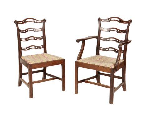 SET OF EIGHT GEORGE III MAHOGANY STYLE DINING CHAIRS, the ladder backs with pierced splat decoration, drop-in upholstered sea