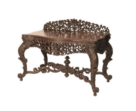 BURMESE CARVED HARDWOOD SIDE TABLE, the serpentine shaped top with a egg and dart mould-ed edge above an ornate open-work fre