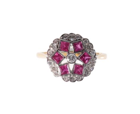 ART DECO STYLE RUBY AND DIAMOND RING, on an 18ct yellow gold shank, with open work shoul-ders, ring size O