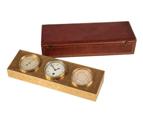 FRENCH CLOCK AND BAROMETER DESK SET, housed in an engraved brass stand, the reverse in-scribed "E. Dreyfus, Paris - Londres -