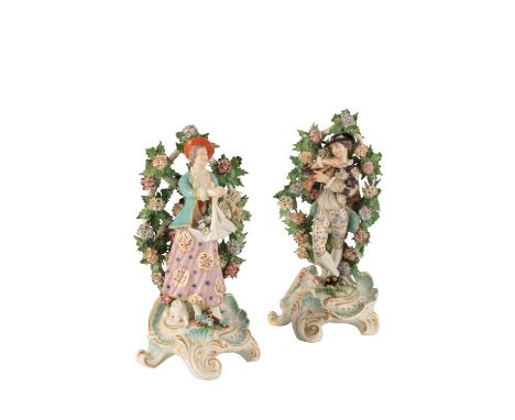 PAIR OF DERBY PORCELAIN FIGURES, 18TH CENTURY, modelled as a man playing a trumpet and flower seller in brightly coloured tra