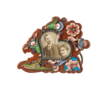 RUSSIAN SILVER AND ENAMEL PHOTOGRAPH FRAME, 19TH CENTURY, the shaped wooden frame with applied enamel foliate decoration, 12c