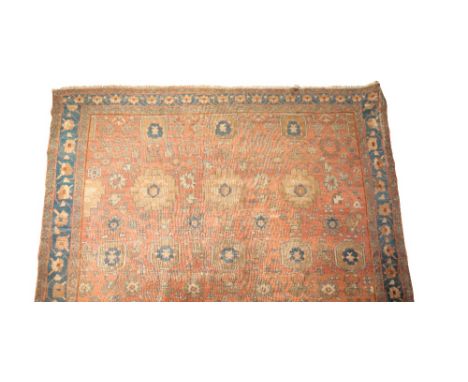 PERSIAN "COUNTRY HOUSE" CARPET of bokhara type, the "burnt orange" ground worked with nu-merous ivory and blue floral and pan