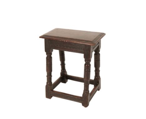 CHARLES II OAK JOINT STOOL, LATE 17TH CENTURY, the moulded rectangular top above a scaly carved frieze, raised on baluster tu