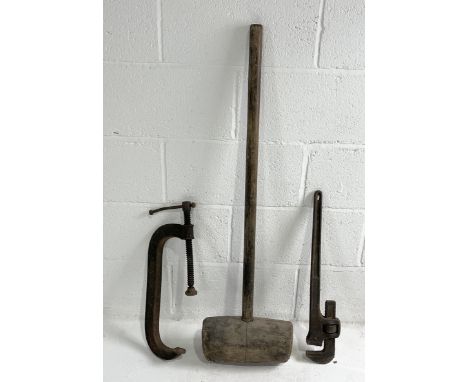 A large vintage wooden mallet marked M.M & S along with a Record G clamp and a pipe wrench 