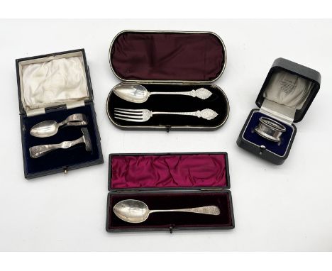 A selection of cased hallmarked silver Christening items including fork and spoon, serviette ring, feeding set (case A/F) and