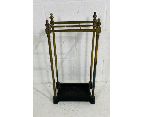 A vintage cast iron based brass umbrella stand 33cm wide, 22cm deep, 64cm high.