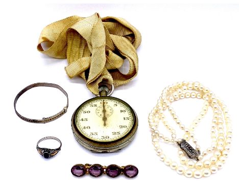 A silver ring with gold highlights set with an amethyst (size J 1/2) along with a Royal Navy pattern 3169 stopwatch with broa