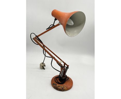 A vintage orange Anglepoise Lighting Ltd. lamp