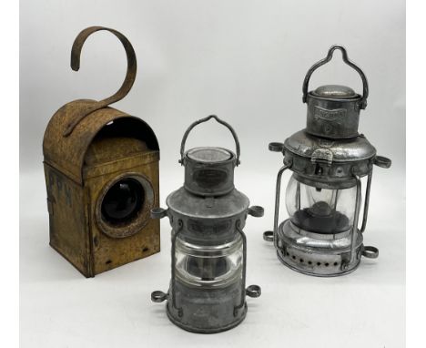 Two ships lanterns named to Pascall Atkey & Son and O.M Watts Ltd along with a Greenham road lamp