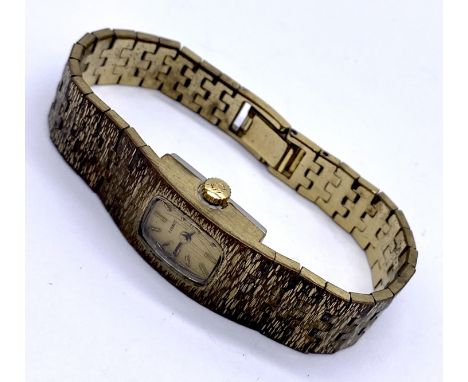 A ladies Rotary 9ct gold watch with integral strap, weight including movement 18.3g