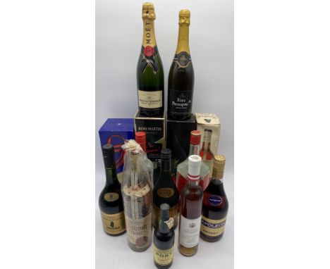 A collection of various alcohol including Vodka, Brandy, Champagne and Cognac