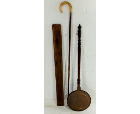 An antique copper warming pan, baguette tray and a horn handled walking stick