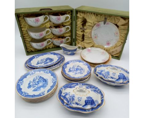 A cased vintage tea set comprising six cups and saucers along with a part blue and white child's willow pattern dinner servic