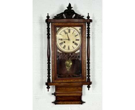 A turn of the century inlaid wall clock, (one missing finial as pictured) comes with five keys. 