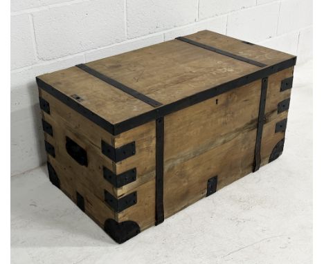 A metal bound pine trunk with cast iron handles to either end - 91cm x 51cm x 48cm