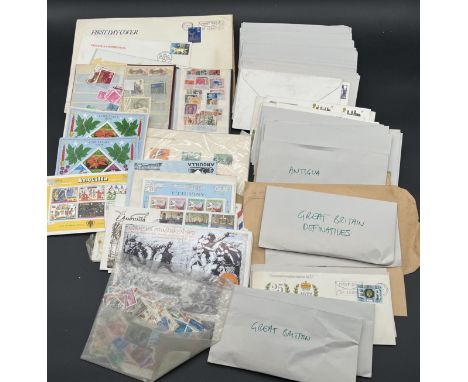 A collection of vintage worldwide loose stamps including a selection of stamps from Anguilla, Swedish Stamps 1972 presentatio