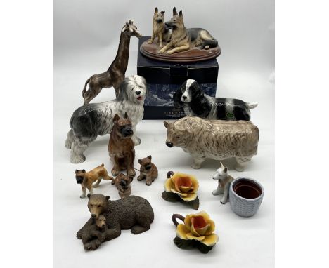 A collection of various animals figurines including Border Fine Arts German Shepherd, Melba Ware dogs etc 