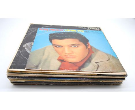 A small quantity of various 12" vinyl records, including The Rolling Stones, Elvis Presley, The Eagles, Gerry Rafferty, Elton